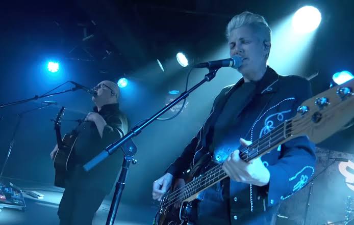 Pixies guitarist and vocalist performing together on stage